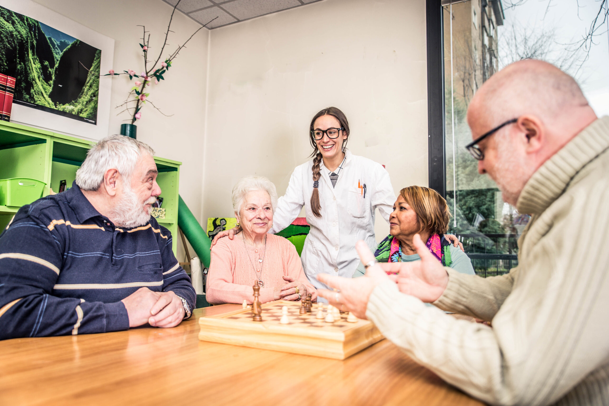 Care Home Fall Prevention Tech - staff and residents talking
