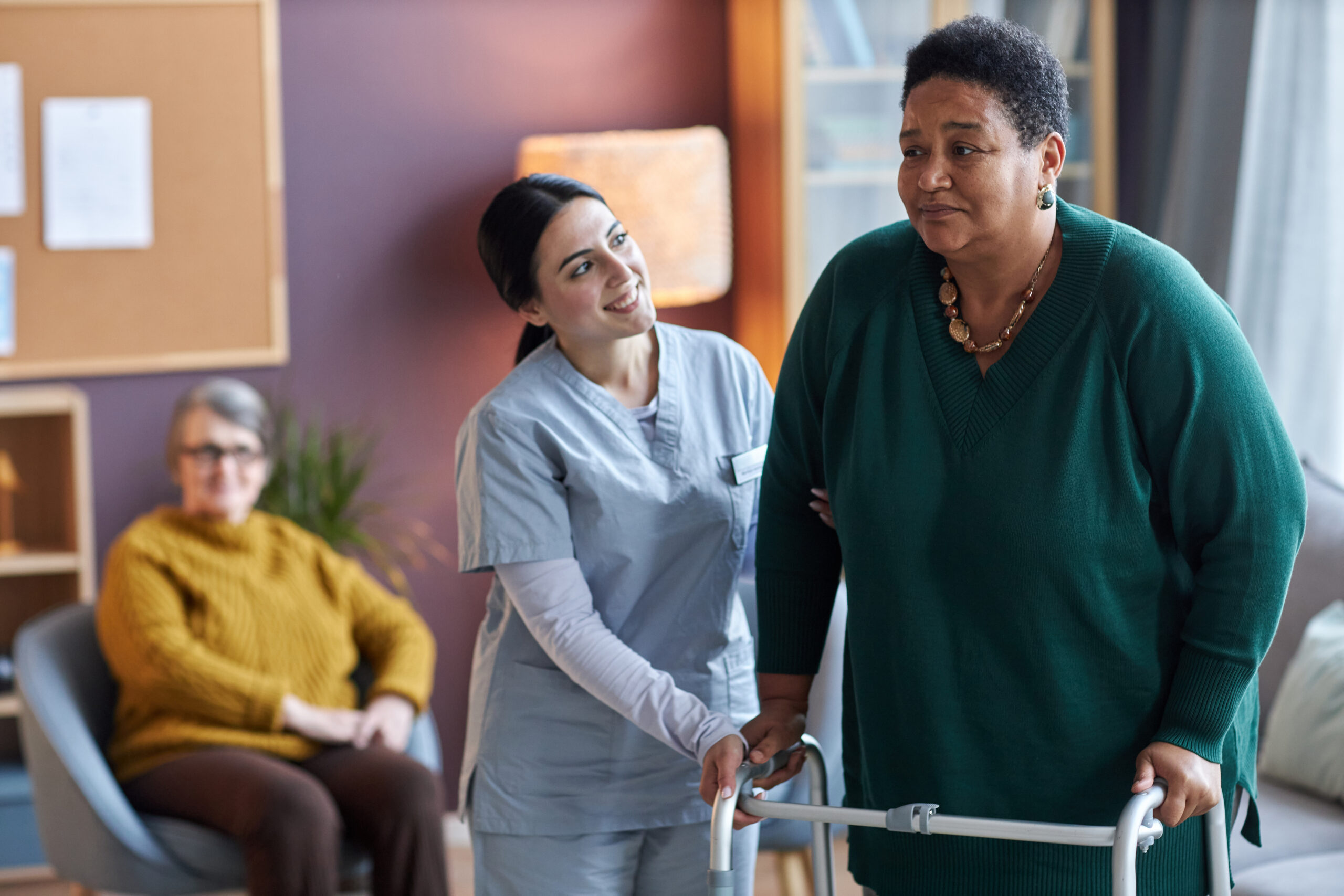 Care Home Fall Prevention Tech - staff member helping resident